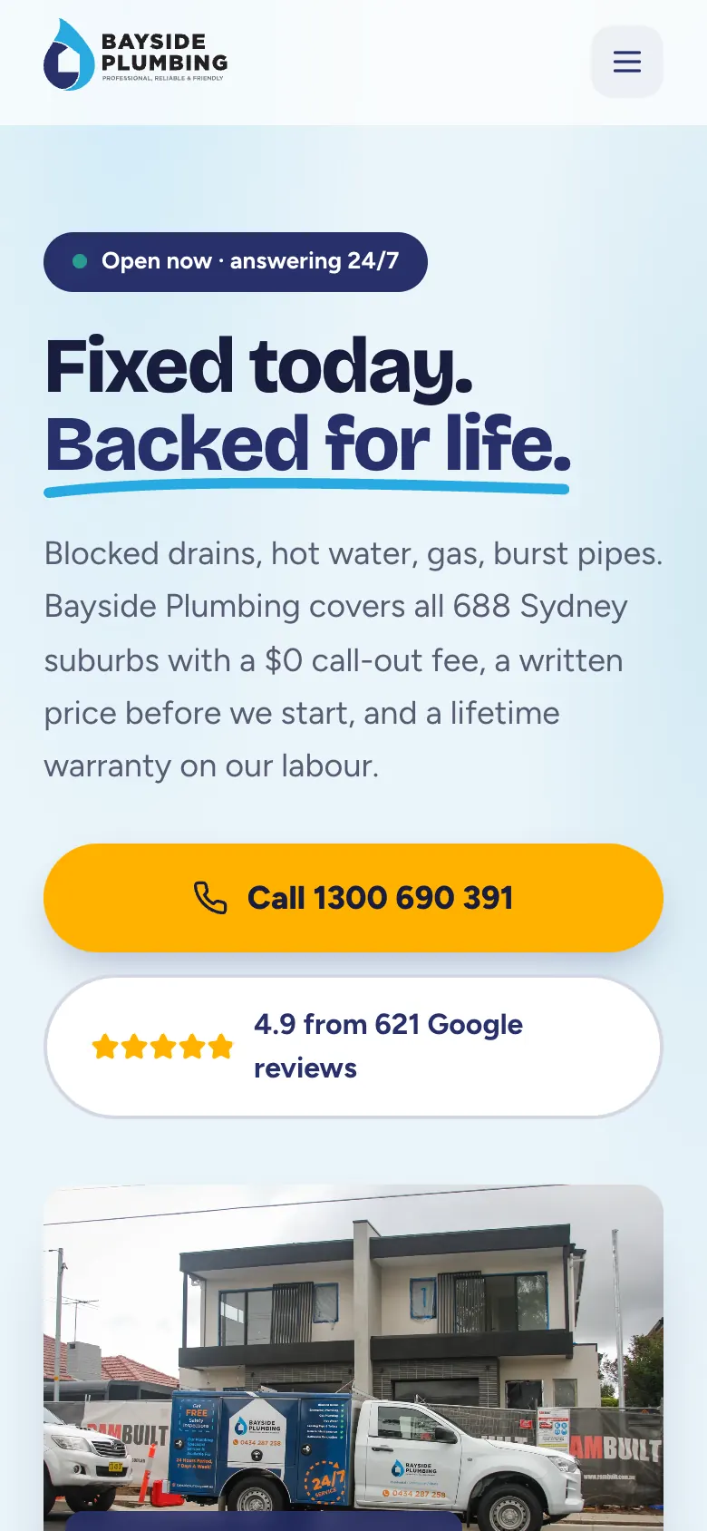 Bayside Plumbing home page on a phone with a large call button under the headline